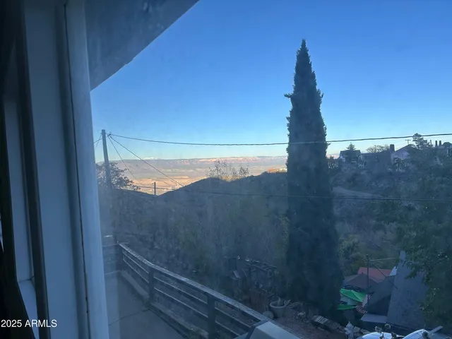 a view of a yard from a balcony