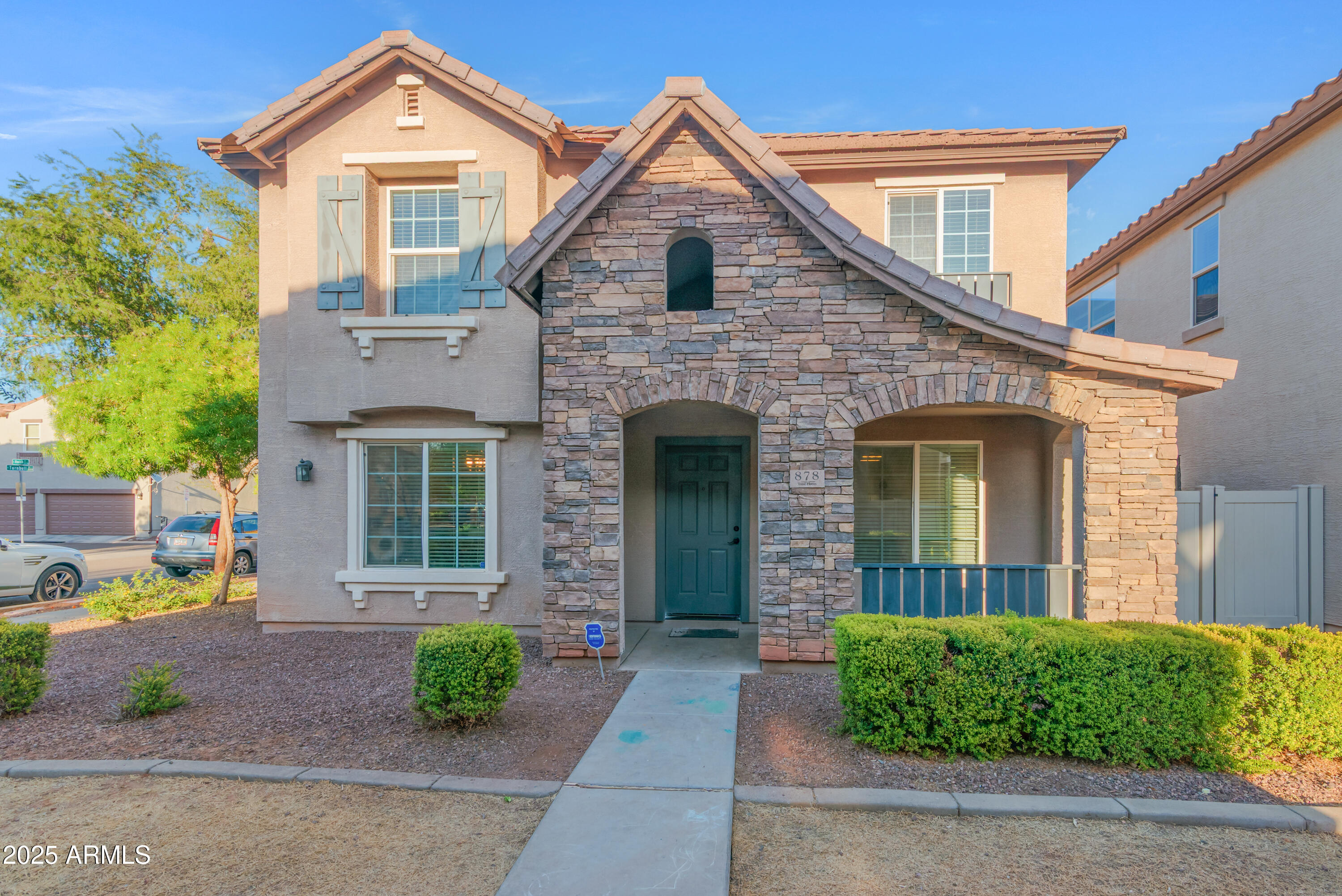 878 South Huish Drive, Unit LOT 105 Gilbert, AZ 85296 - Photo 1 of 51 front view of a house with a yard