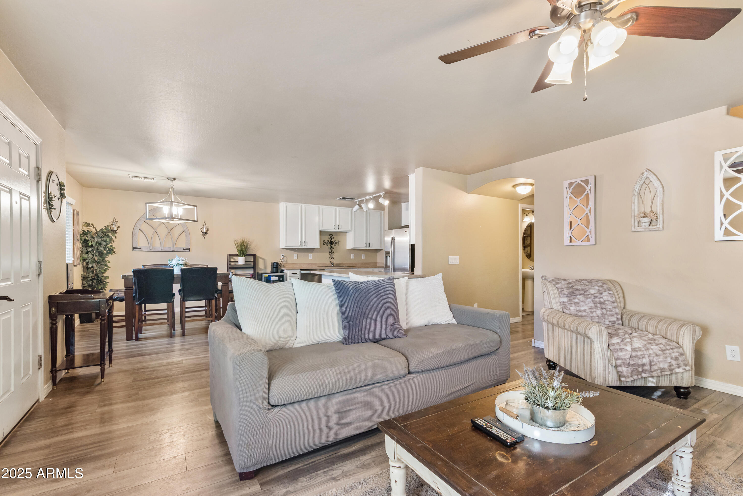 878 South Huish Drive, Unit LOT 105 Gilbert, AZ 85296 - Photo 11 of 51 a living room with furniture and view of kitchen