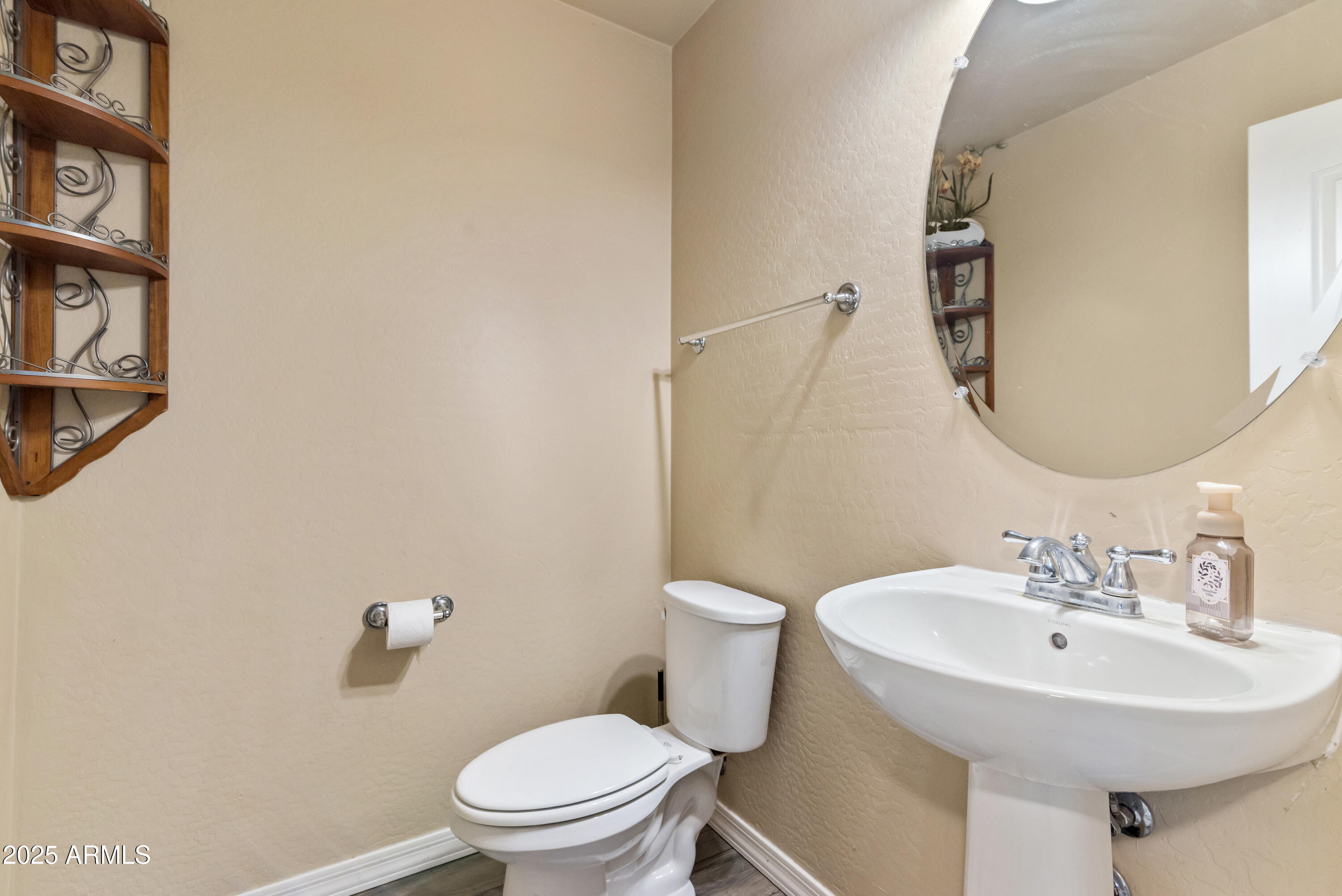 878 South Huish Drive, Unit LOT 105 Gilbert, AZ 85296 - Photo 15 of 51 a bathroom with a sink mirror and toilet