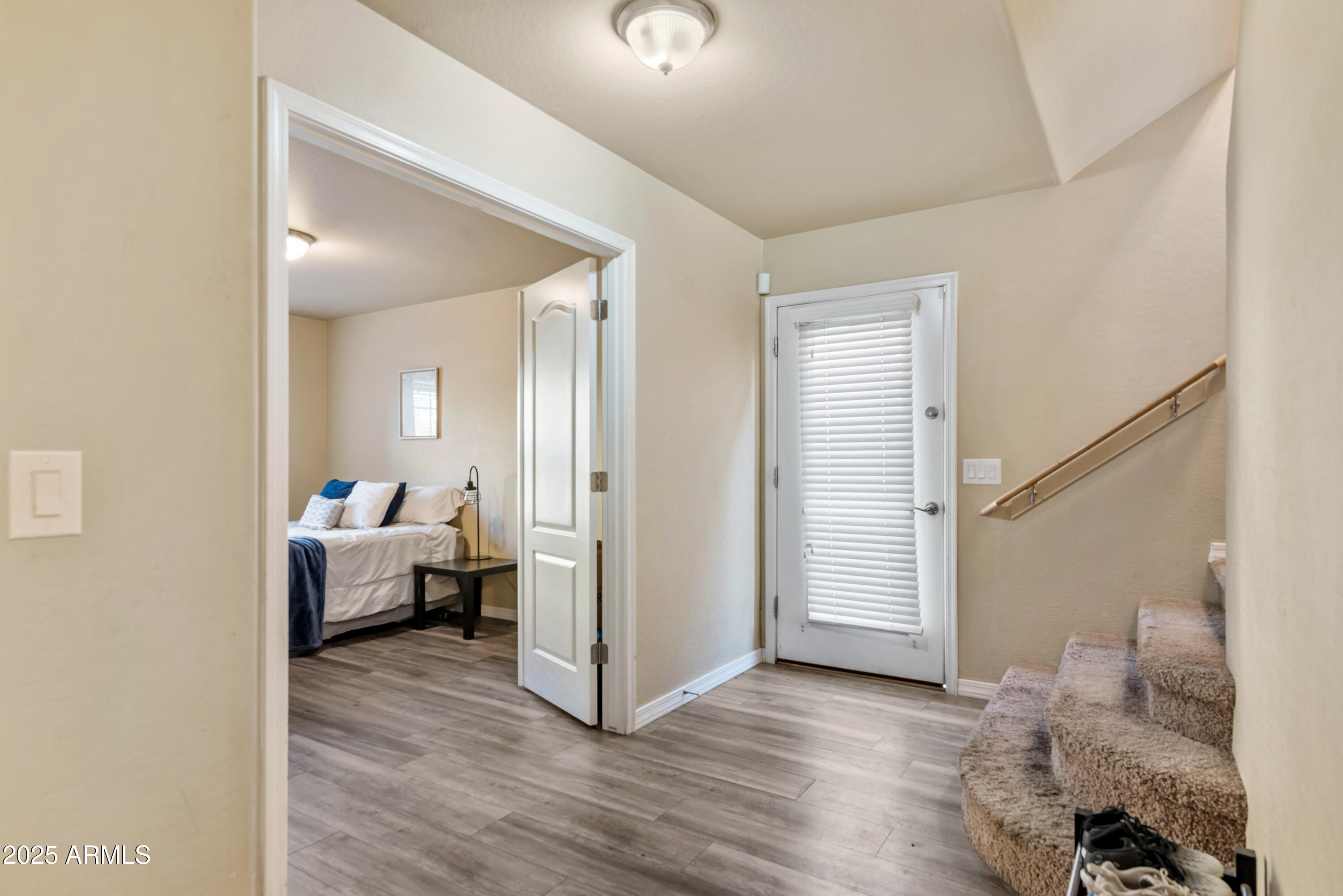 878 South Huish Drive, Unit LOT 105 Gilbert, AZ 85296 - Photo 16 of 51 a view of a bedroom with wooden floor and windows