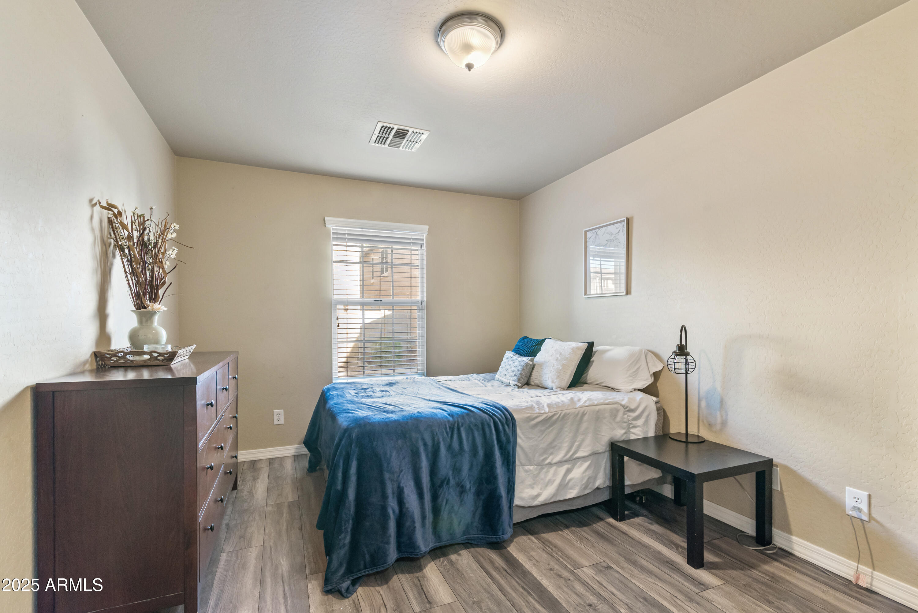 878 South Huish Drive, Unit LOT 105 Gilbert, AZ 85296 - Photo 17 of 51 a bedroom with a bed and wooden floor