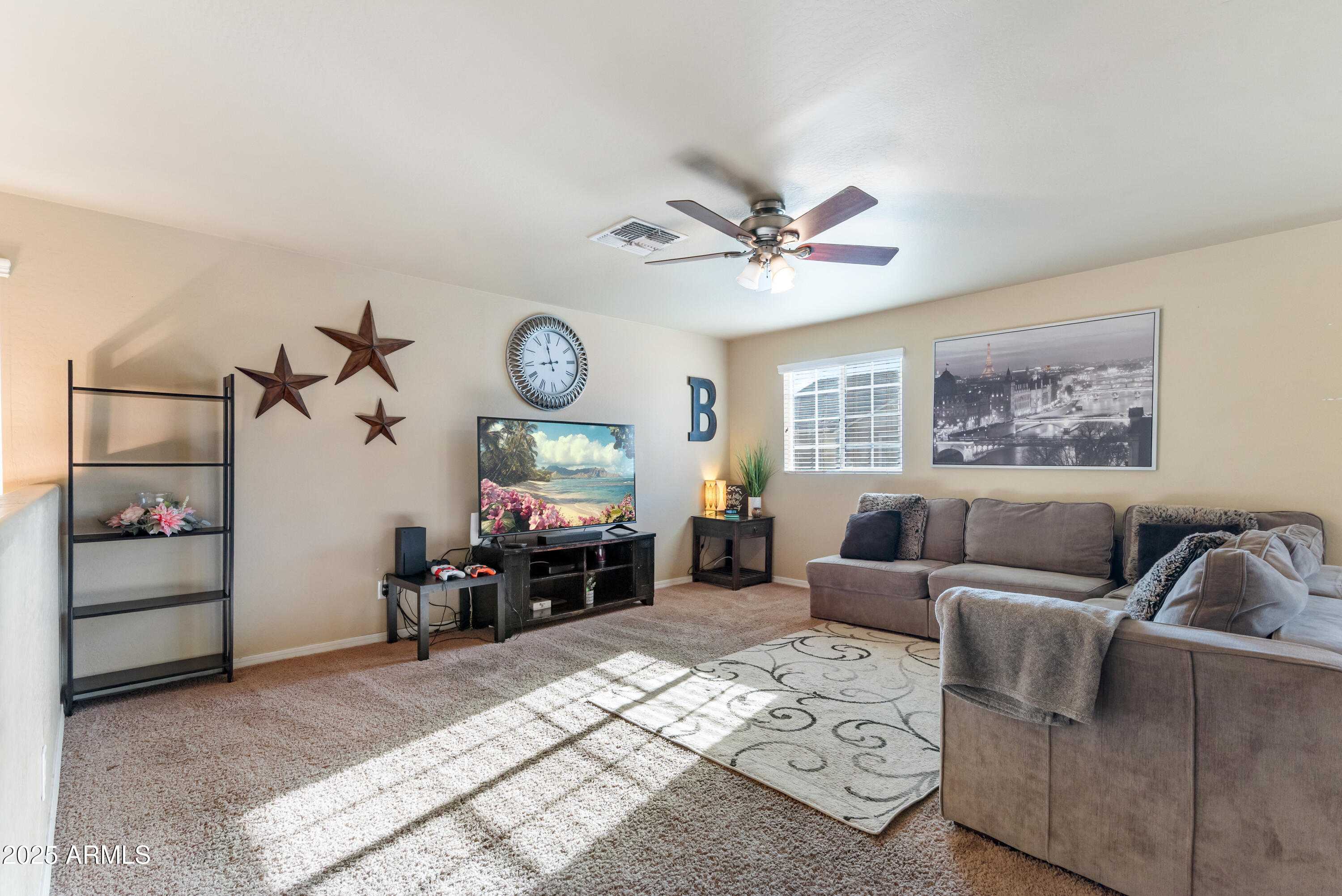 878 South Huish Drive, Unit LOT 105 Gilbert, AZ 85296 - Photo 18 of 51 a living room with furniture a clock and a window