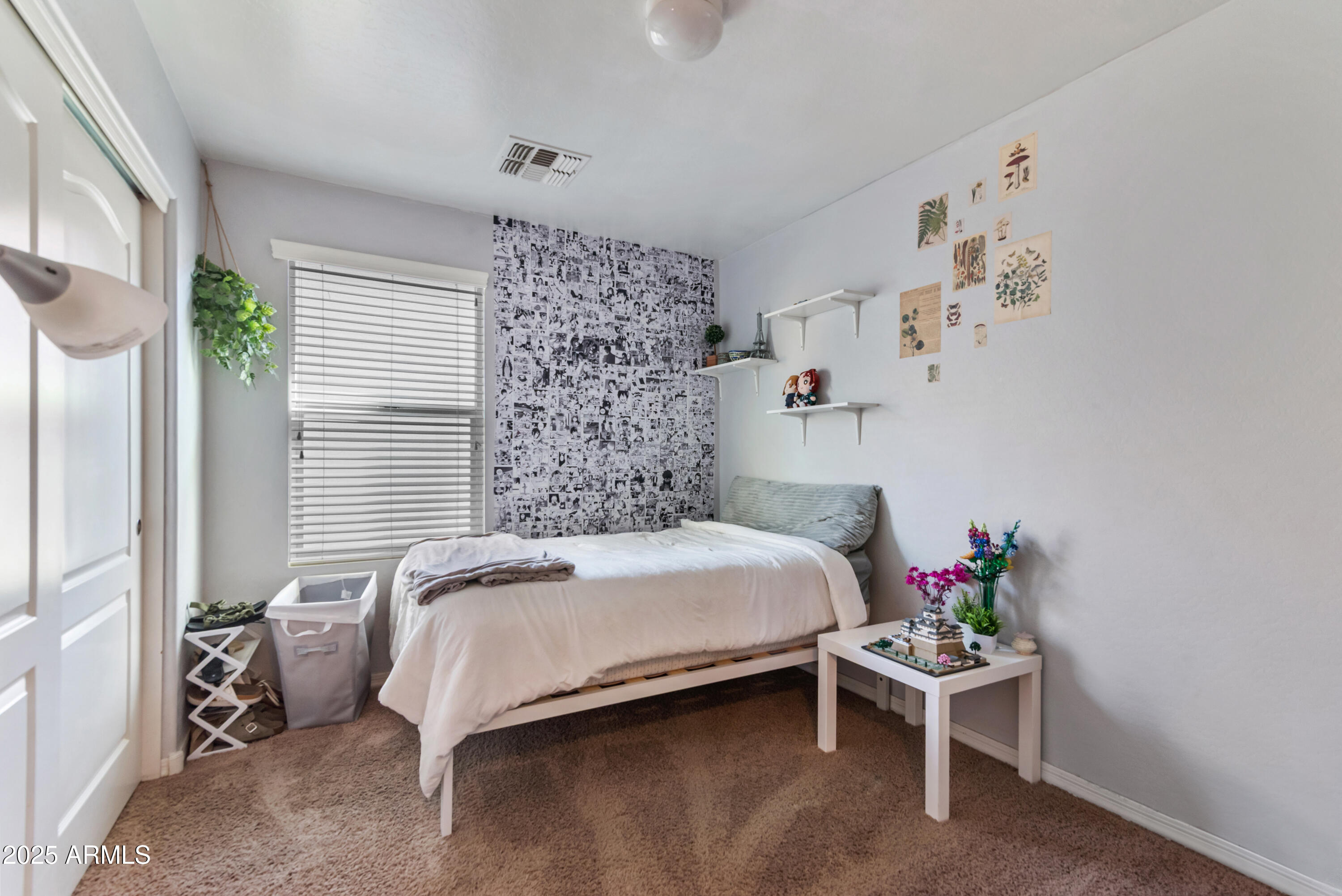 878 South Huish Drive, Unit LOT 105 Gilbert, AZ 85296 - Photo 28 of 51 a bedroom with a bed and a potted plant