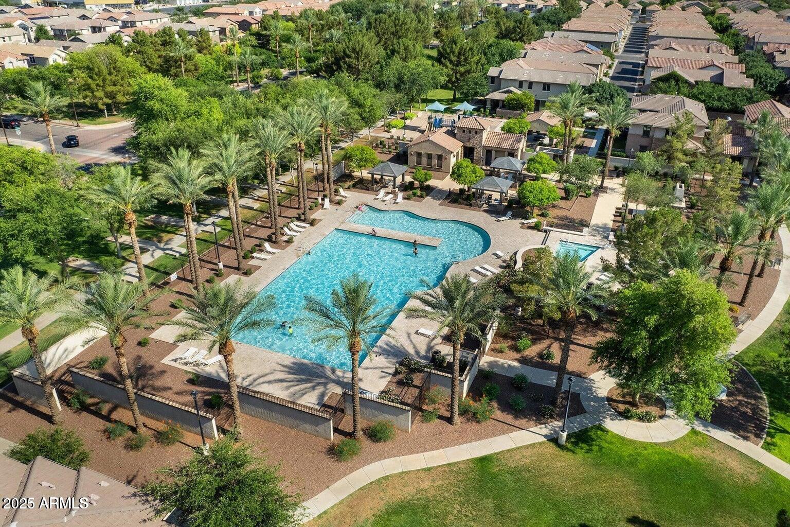 878 South Huish Drive, Unit LOT 105 Gilbert, AZ 85296 - Photo 32 of 51 an aerial view of multiple houses with yard