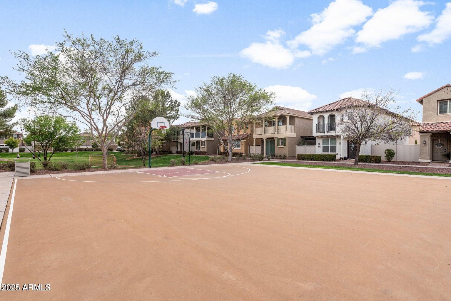 878 South Huish Drive, Unit LOT 105 Gilbert, AZ 85296 - Photo 39 of 51 a view of large house with a big yard and large trees