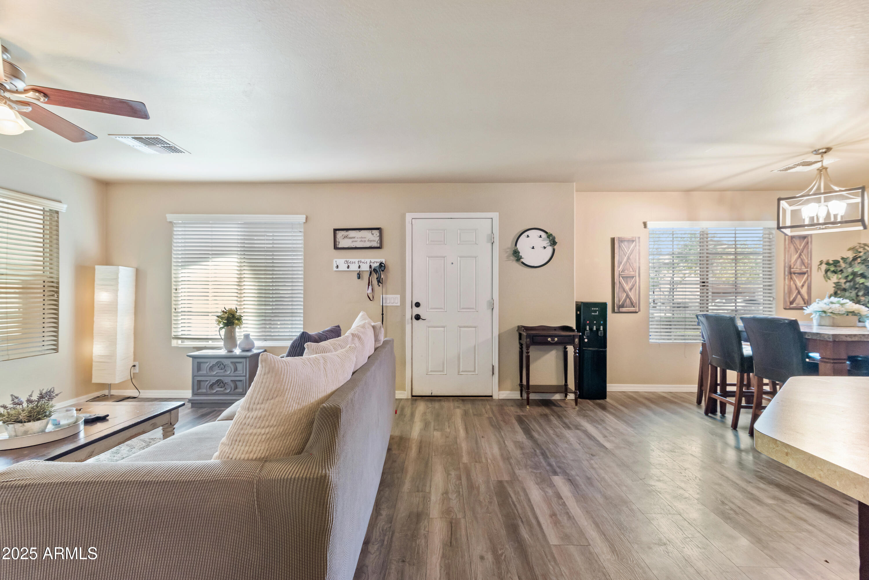 878 South Huish Drive, Unit LOT 105 Gilbert, AZ 85296 - Photo 4 of 51 a living room with furniture and wooden floor