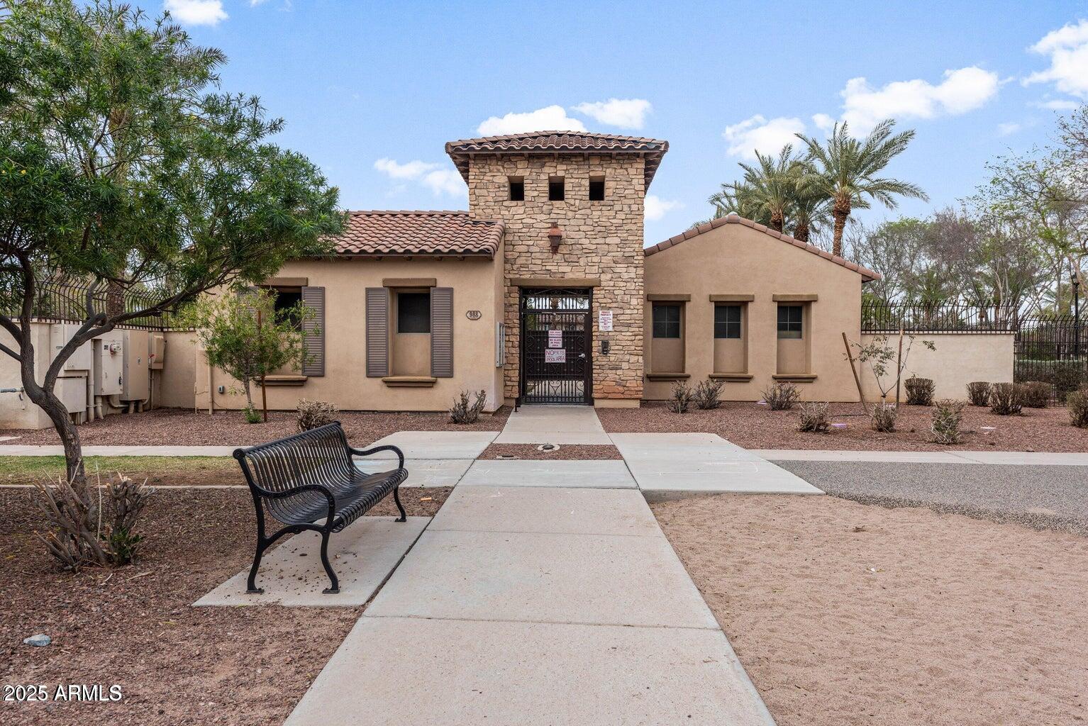 878 South Huish Drive, Unit LOT 105 Gilbert, AZ 85296 - Photo 43 of 51 a front view of a house with yard and seating area