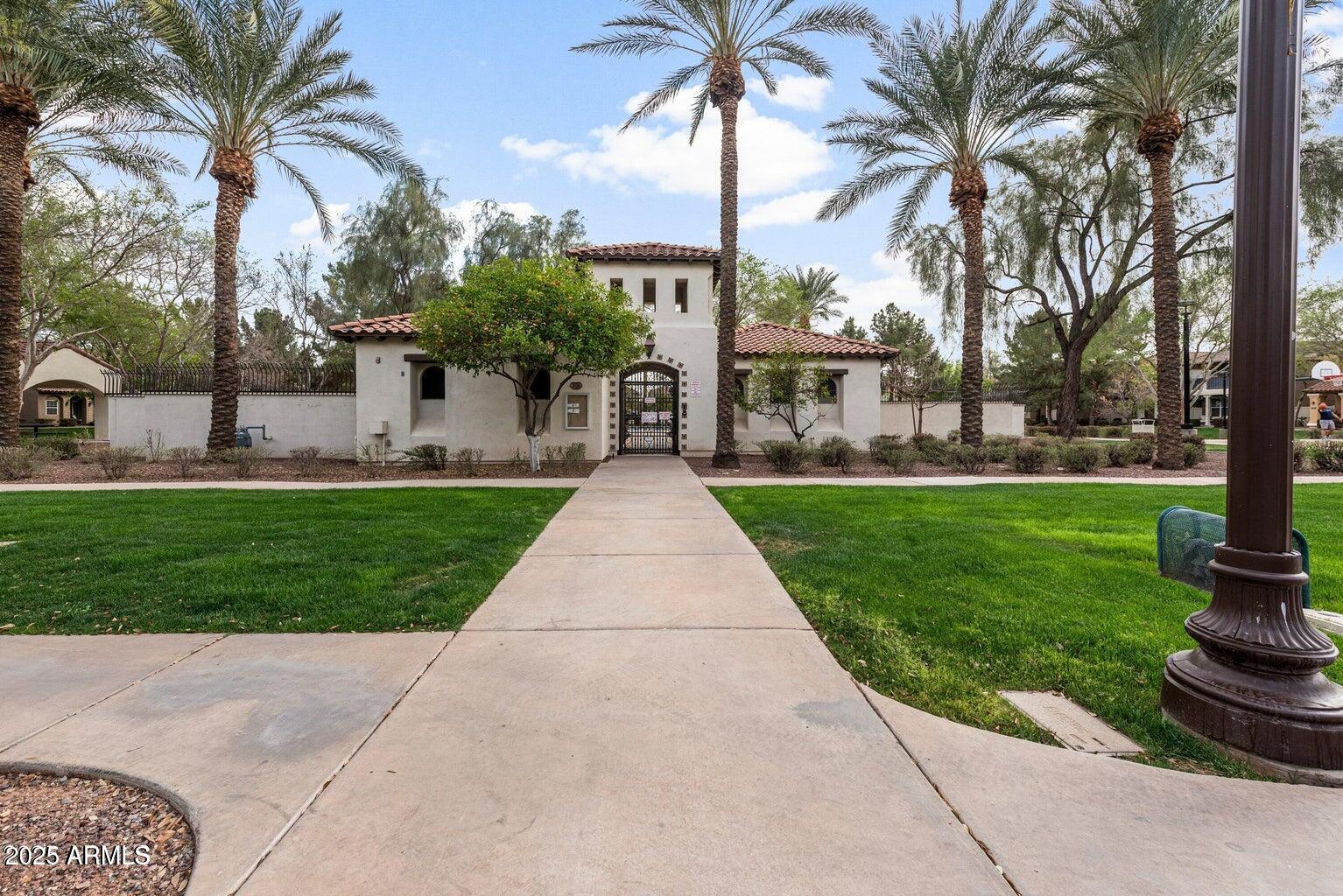878 South Huish Drive, Unit LOT 105 Gilbert, AZ 85296 - Photo 44 of 51 a front view of a residential houses with yard and green space