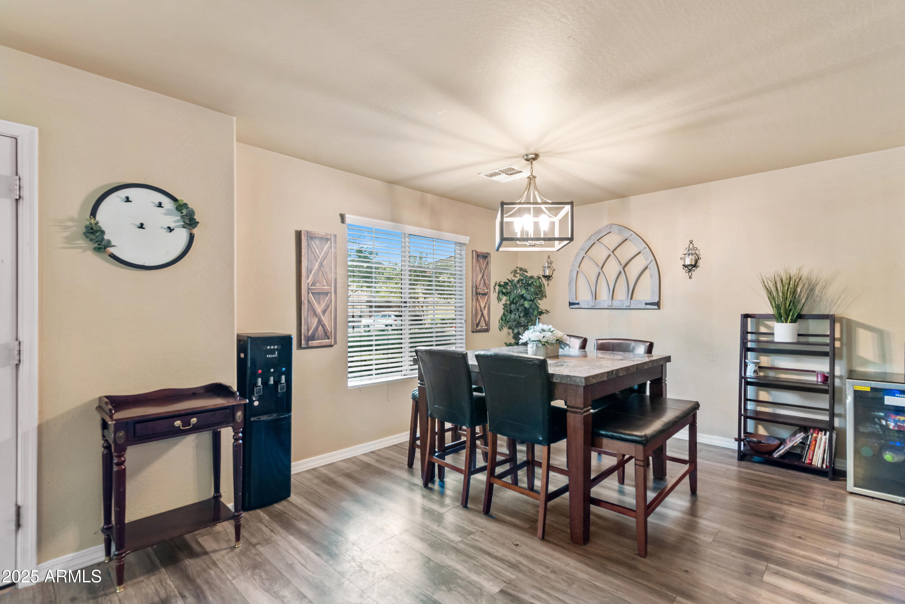 878 South Huish Drive, Unit LOT 105 Gilbert, AZ 85296 - Photo 6 of 51 a view of a dining room with furniture window and wooden floor