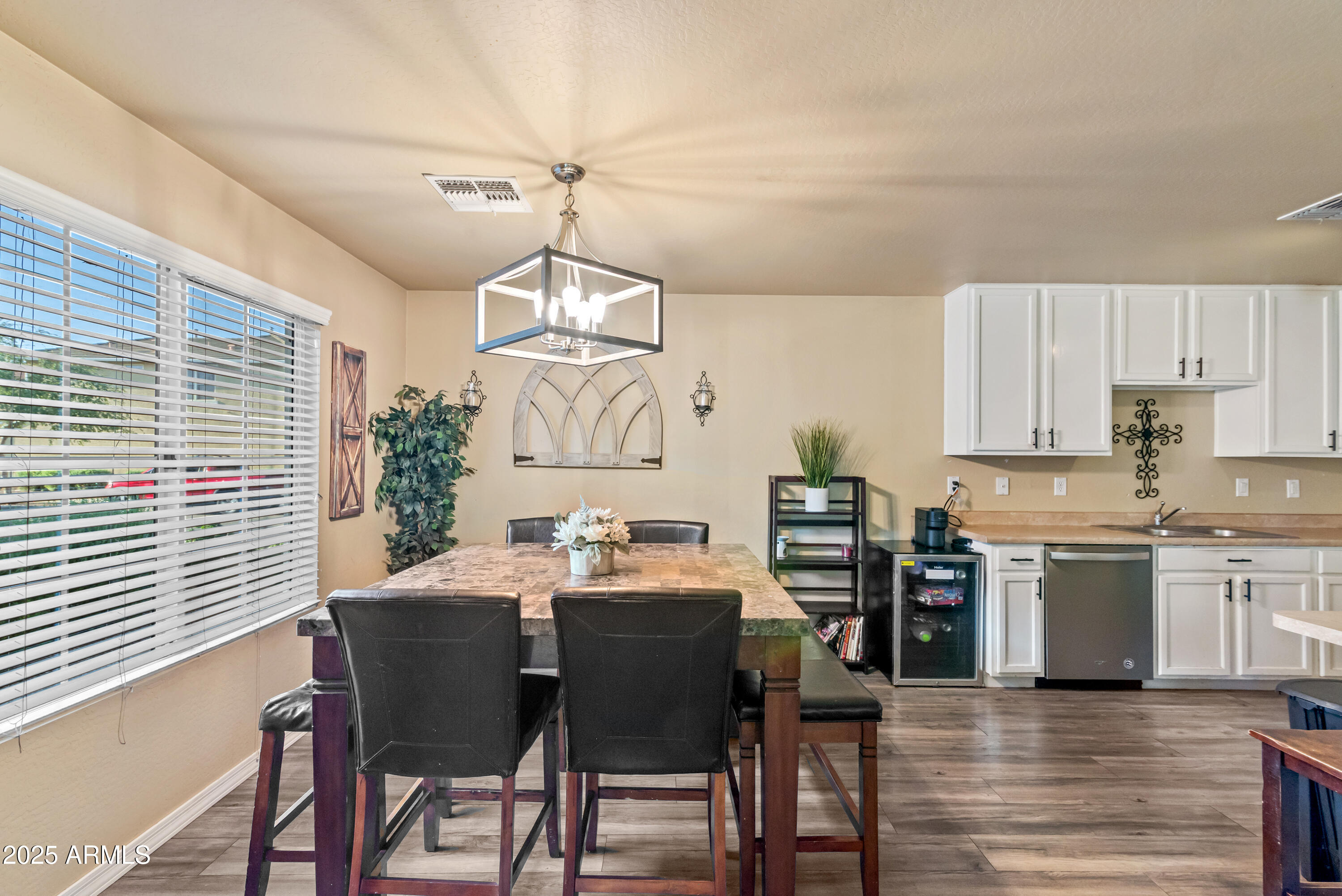 878 South Huish Drive, Unit LOT 105 Gilbert, AZ 85296 - Photo 7 of 51 a view of a dining room with furniture window and wooden floor