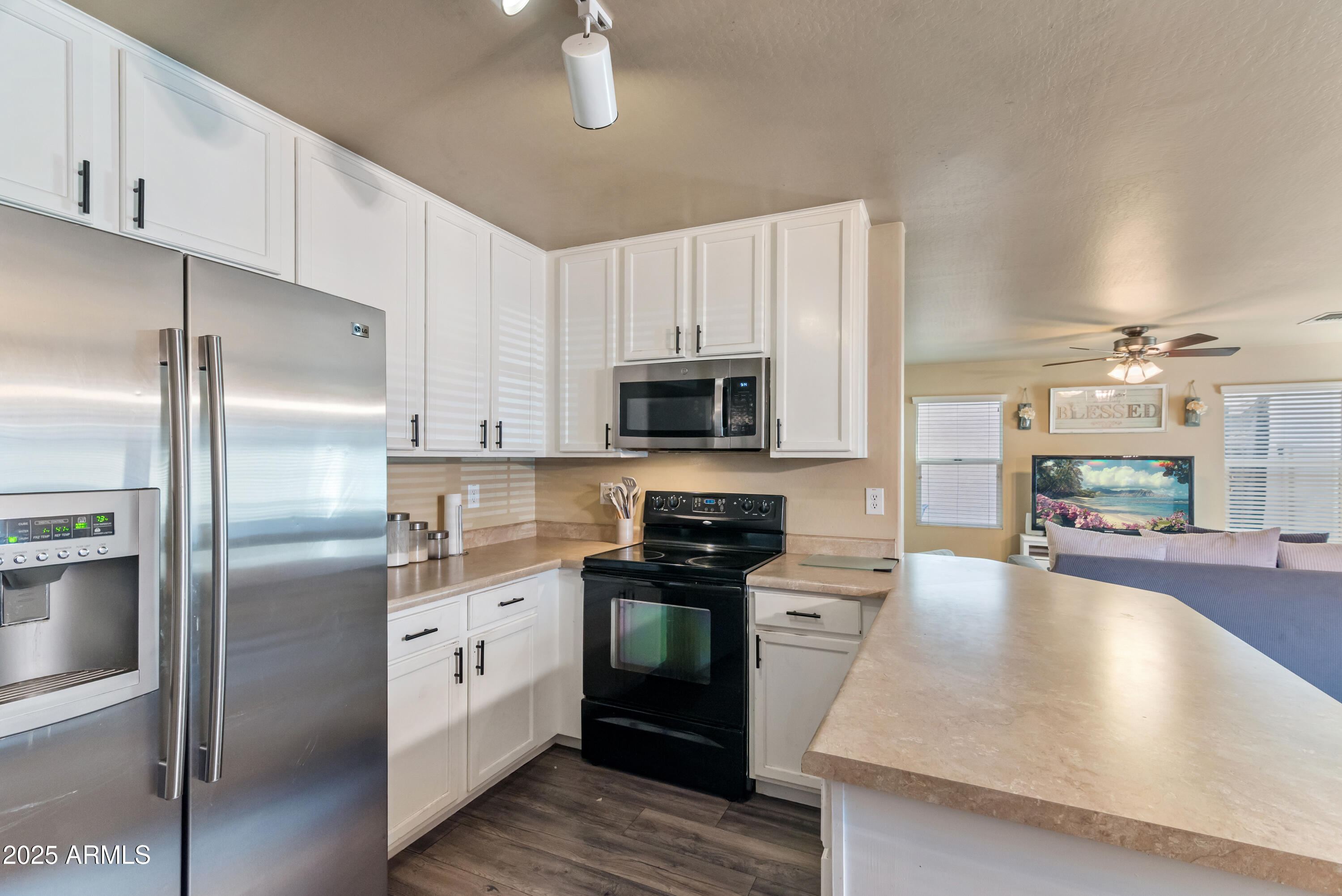 878 South Huish Drive, Unit LOT 105 Gilbert, AZ 85296 - Photo 10 of 51 a kitchen with stainless steel appliances granite countertop a refrigerator a stove and a sink