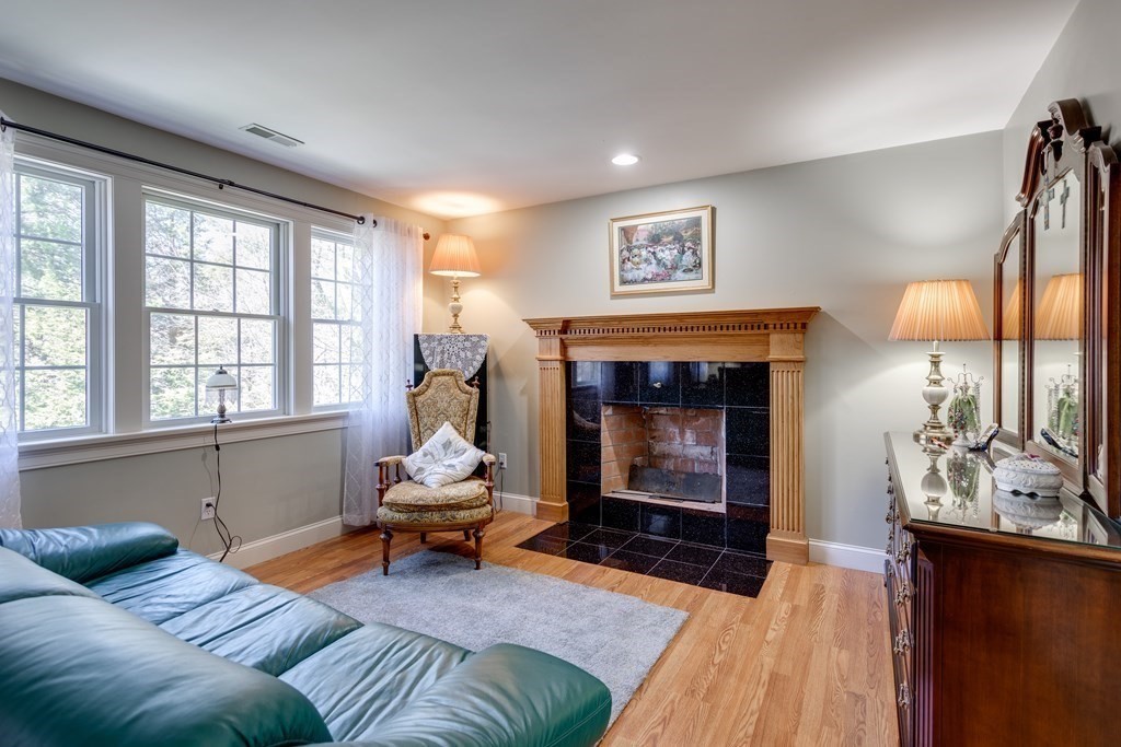 97 Glenwood Road Rutland, MA 01543 - Photo 13 of 26 a living room with furniture and a fireplace
