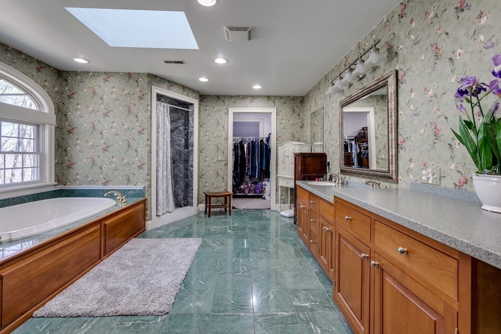 97 Glenwood Road Rutland, MA 01543 - Photo 14 of 26 a large bathroom with a large tub and sink