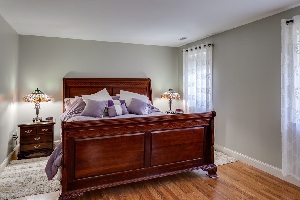 97 Glenwood Road Rutland, MA 01543 - Photo 16 of 26 a bed room with a bed and a night stand