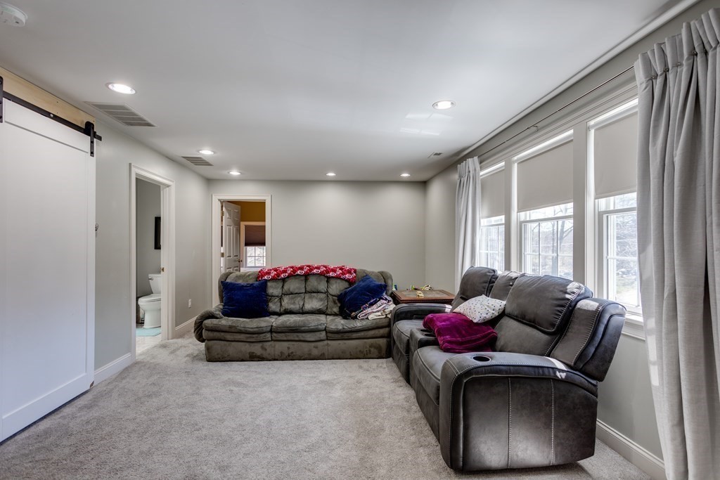 97 Glenwood Road Rutland, MA 01543 - Photo 18 of 26 a living room with furniture and a large window