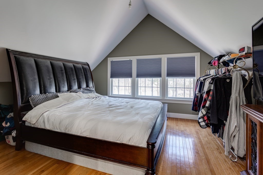 97 Glenwood Road Rutland, MA 01543 - Photo 19 of 26 a bed sitting in a bedroom next to a window