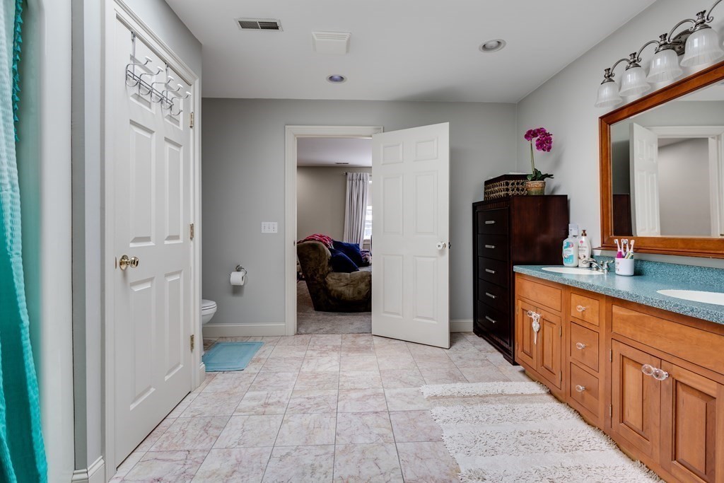 97 Glenwood Road Rutland, MA 01543 - Photo 20 of 26 a large bathroom with a sink a mirror and a shower