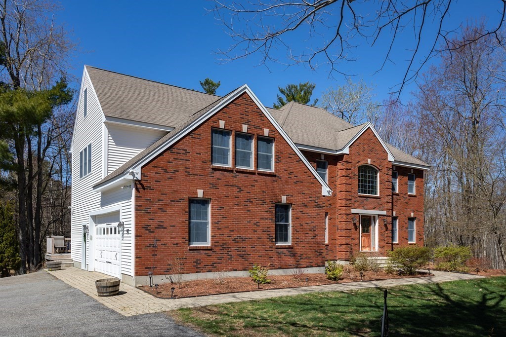 97 Glenwood Road Rutland, MA 01543 - Photo 2 of 26 a front view of a house with a yard