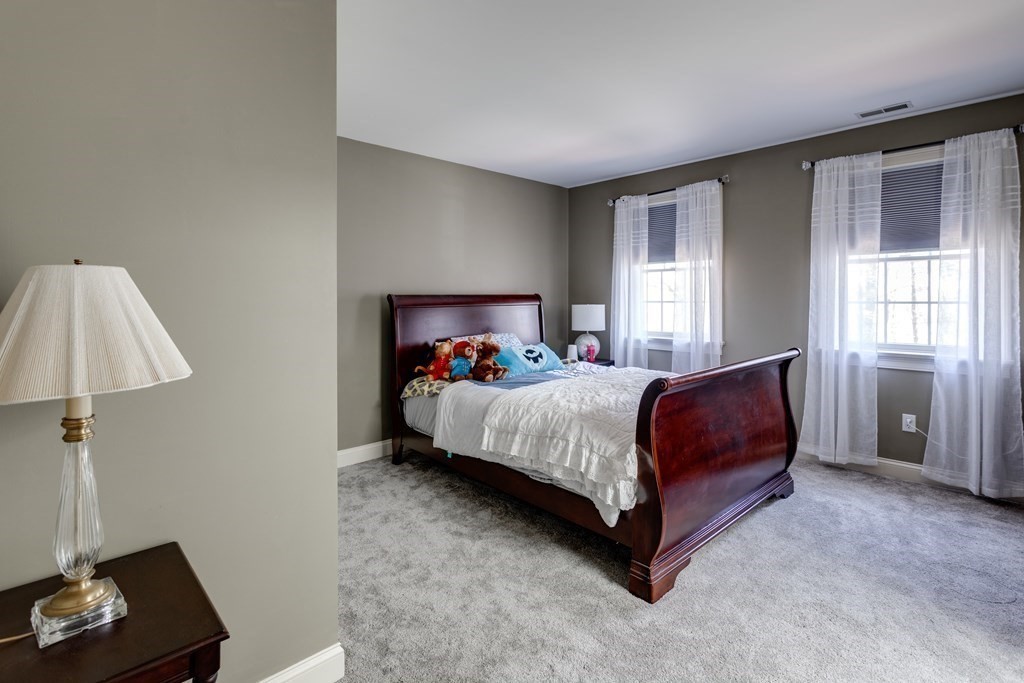 97 Glenwood Road Rutland, MA 01543 - Photo 21 of 26 a bedroom with a bed and a window
