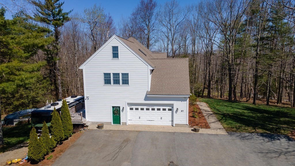 97 Glenwood Road Rutland, MA 01543 - Photo 22 of 26 a view of a house with a yard and garage
