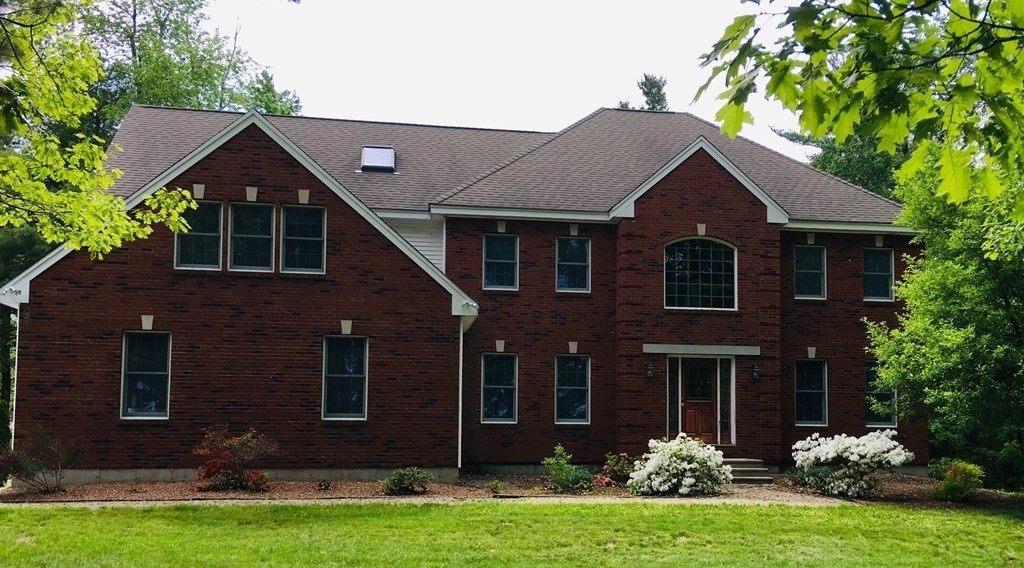 97 Glenwood Road Rutland, MA 01543 - Photo 3 of 26 a front view of a house with a yard