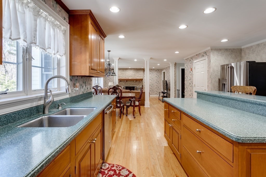 97 Glenwood Road Rutland, MA 01543 - Photo 5 of 26 a kitchen with stainless steel appliances granite countertop a sink counter space and a large window