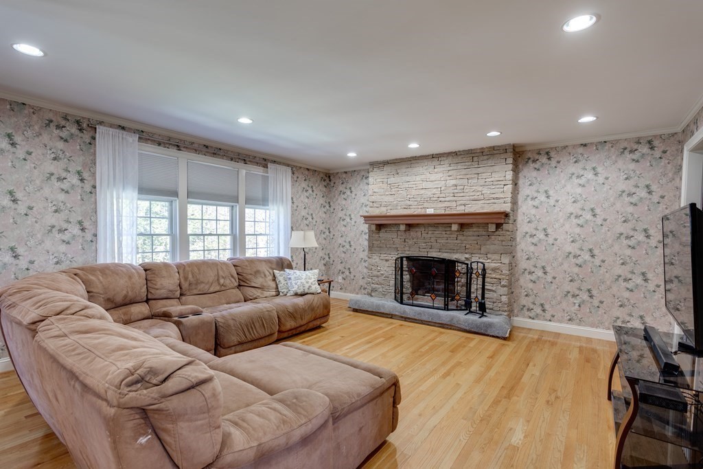 97 Glenwood Road Rutland, MA 01543 - Photo 9 of 26 a living room with furniture and a fireplace