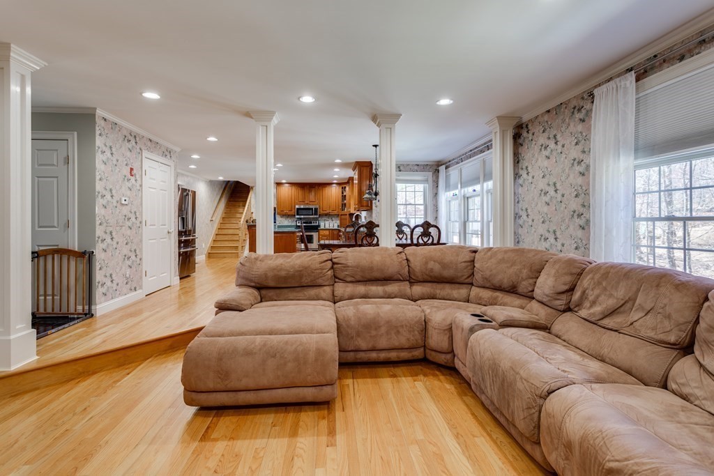 97 Glenwood Road Rutland, MA 01543 - Photo 10 of 26 a living room with furniture and a wooden floor