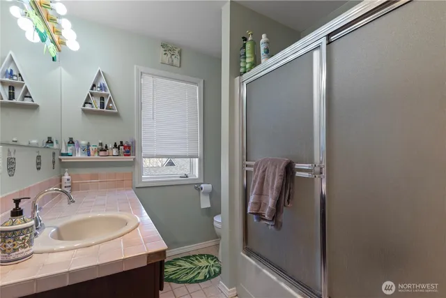 a bathroom with a sink and mirror