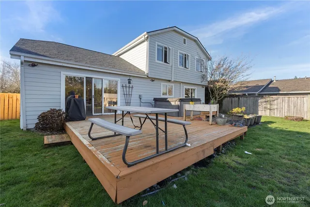 a view of a house with a yard patio and swimming pool