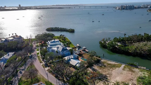 an aerial view of a house with a lake view