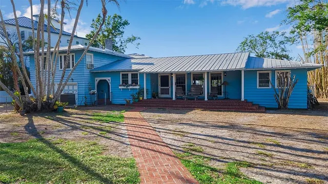 an aerial view of a house with a lake view