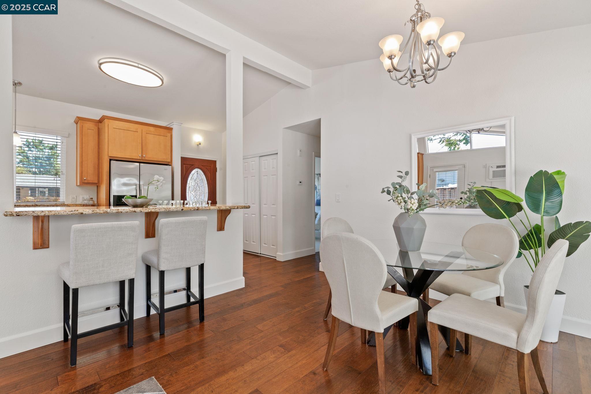 3249 Claudia Drive Concord, CA 94519 - Photo 12 of 34 a dining room with furniture a window and wooden floor