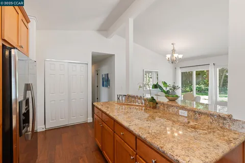 a view of living room with granite countertop furniture and floor to ceiling window