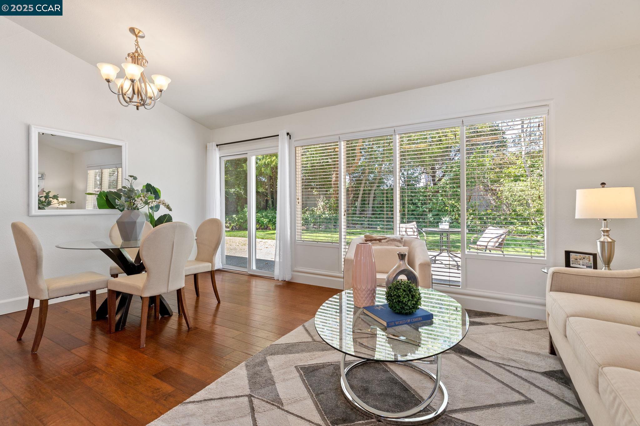 3249 Claudia Drive Concord, CA 94519 - Photo 17 of 34 a dining room with furniture a large window and a potted plant