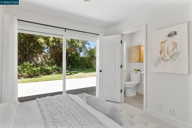 a bathroom with a toilet sink and shower