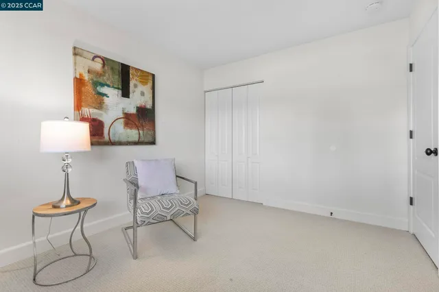 a view of a livingroom with furniture and a window