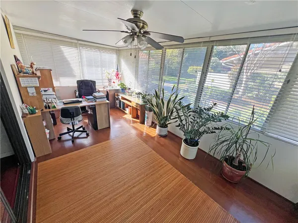 a workspace with furniture and window