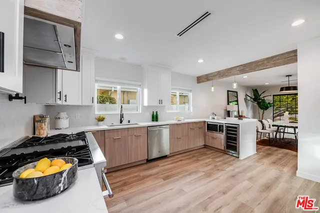 a bathroom with a tub a toilet and a shower