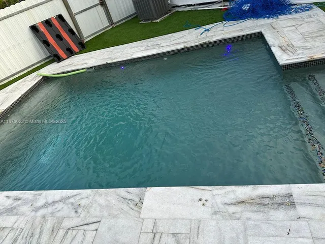 a view of swimming pool outdoor seating