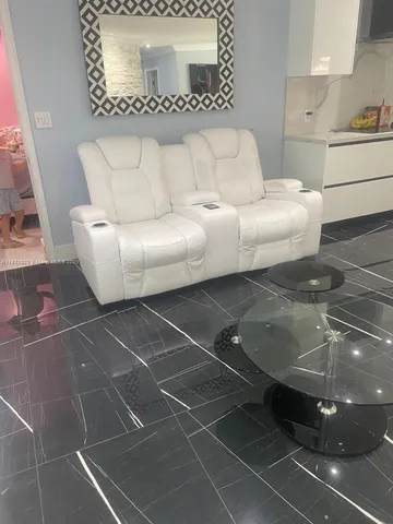 a living room with furniture and a window