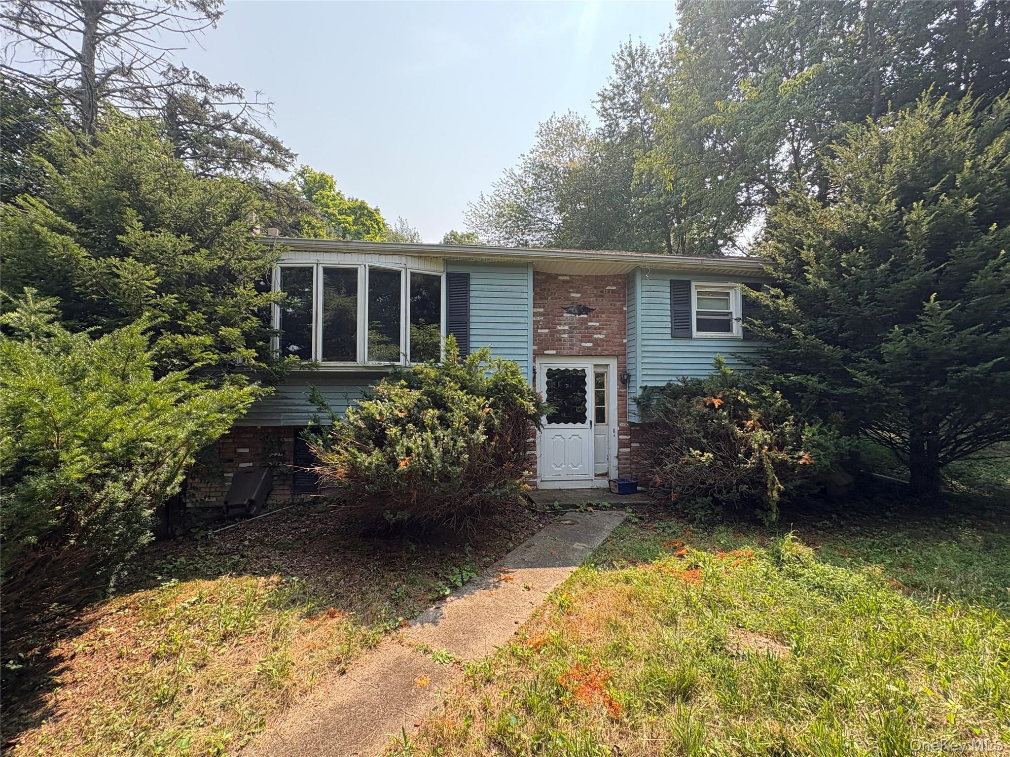Split foyer home featuring brick siding