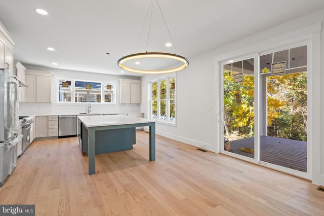 a kitchen with a sink and large window