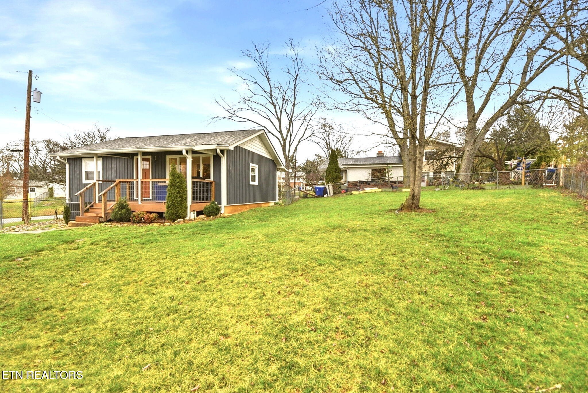 110 Parma Road Oak Ridge, TN 37830 - Photo 18 of 23 a view of a house with a big yard and large trees