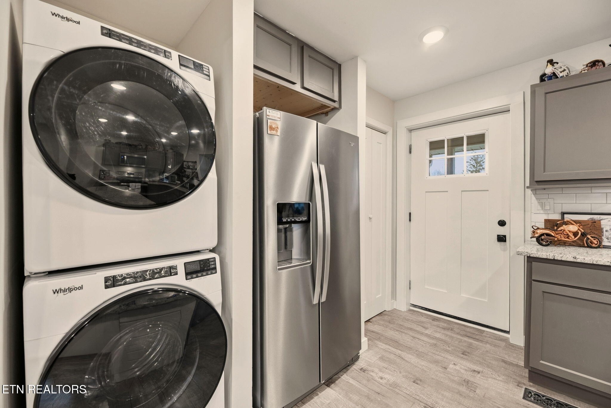 110 Parma Road Oak Ridge, TN 37830 - Photo 10 of 23 a view of a kitchen with stainless steel appliances a refrigerator and a washer dryer