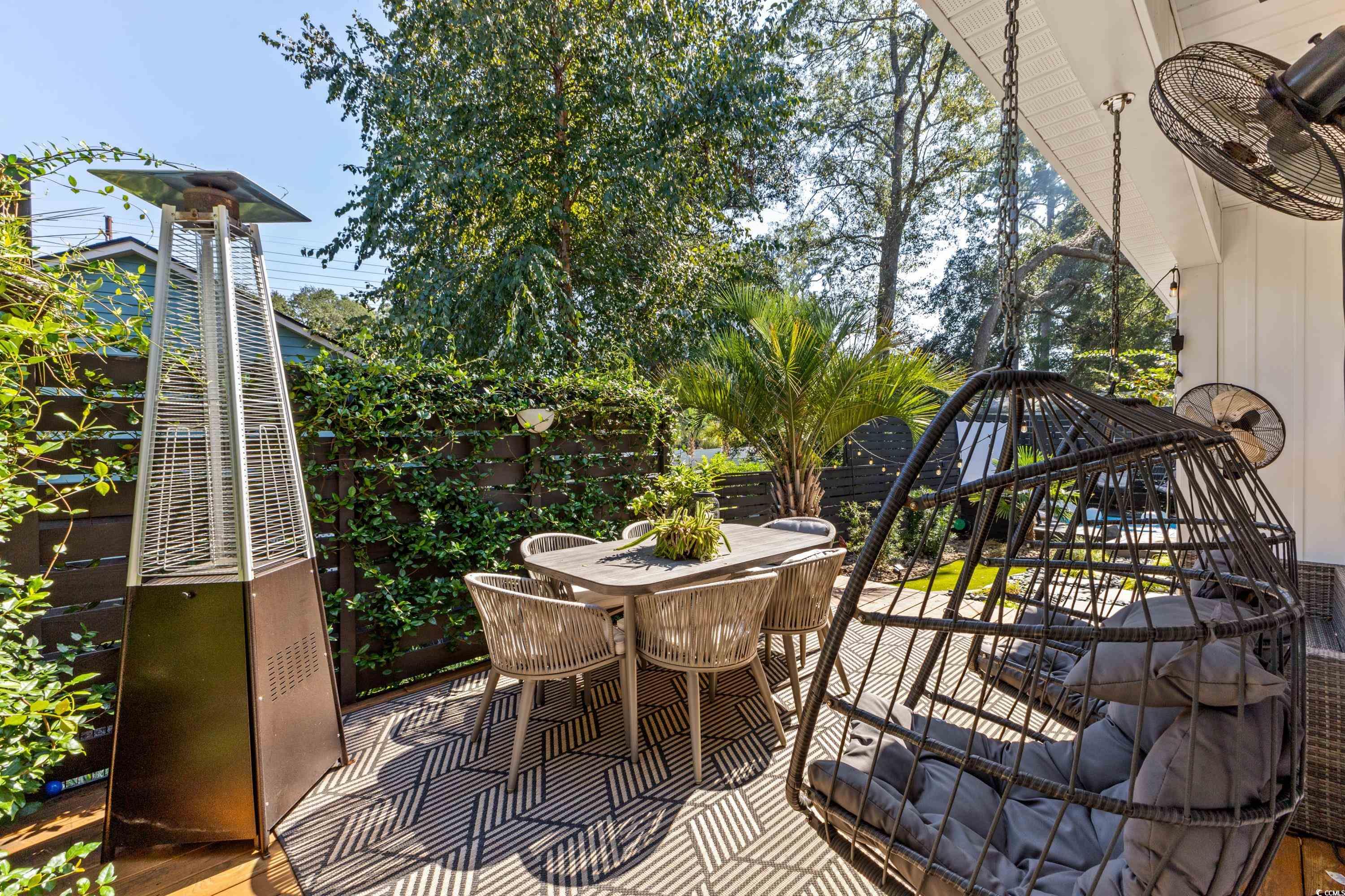 595 Wilcox Avenue Murrells Inlet, SC 29576 - Photo 21 of 40 View of patio featuring outdoor dining space and f