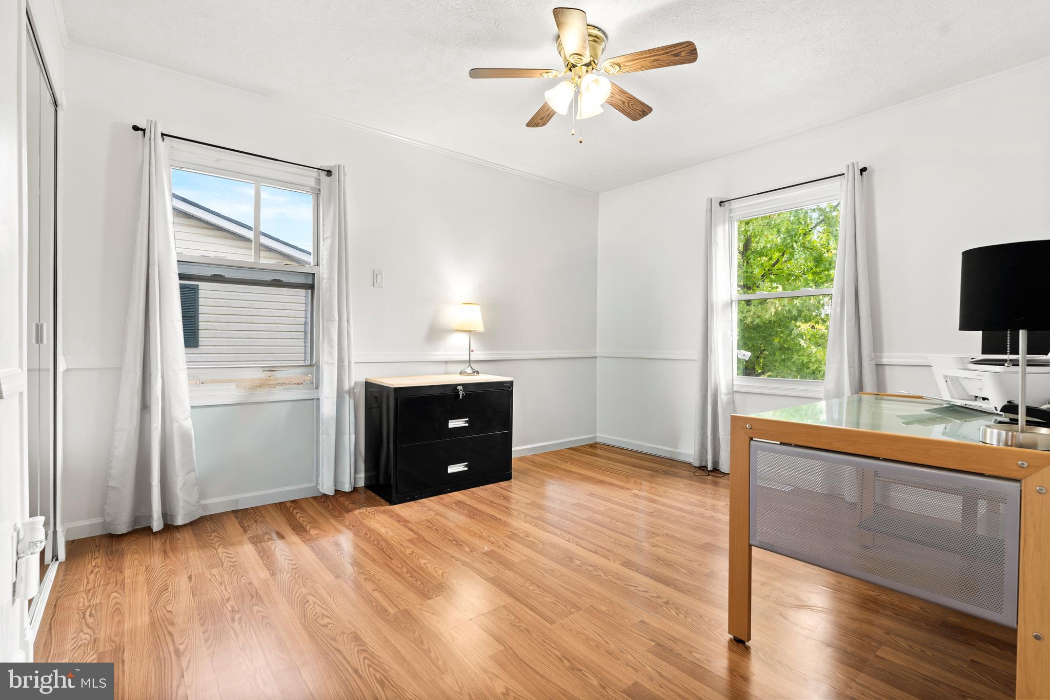 7907 Stone Hearth Road Severn, MD 21144 - Photo 17 of 24 a room with a bed and a flat screen tv