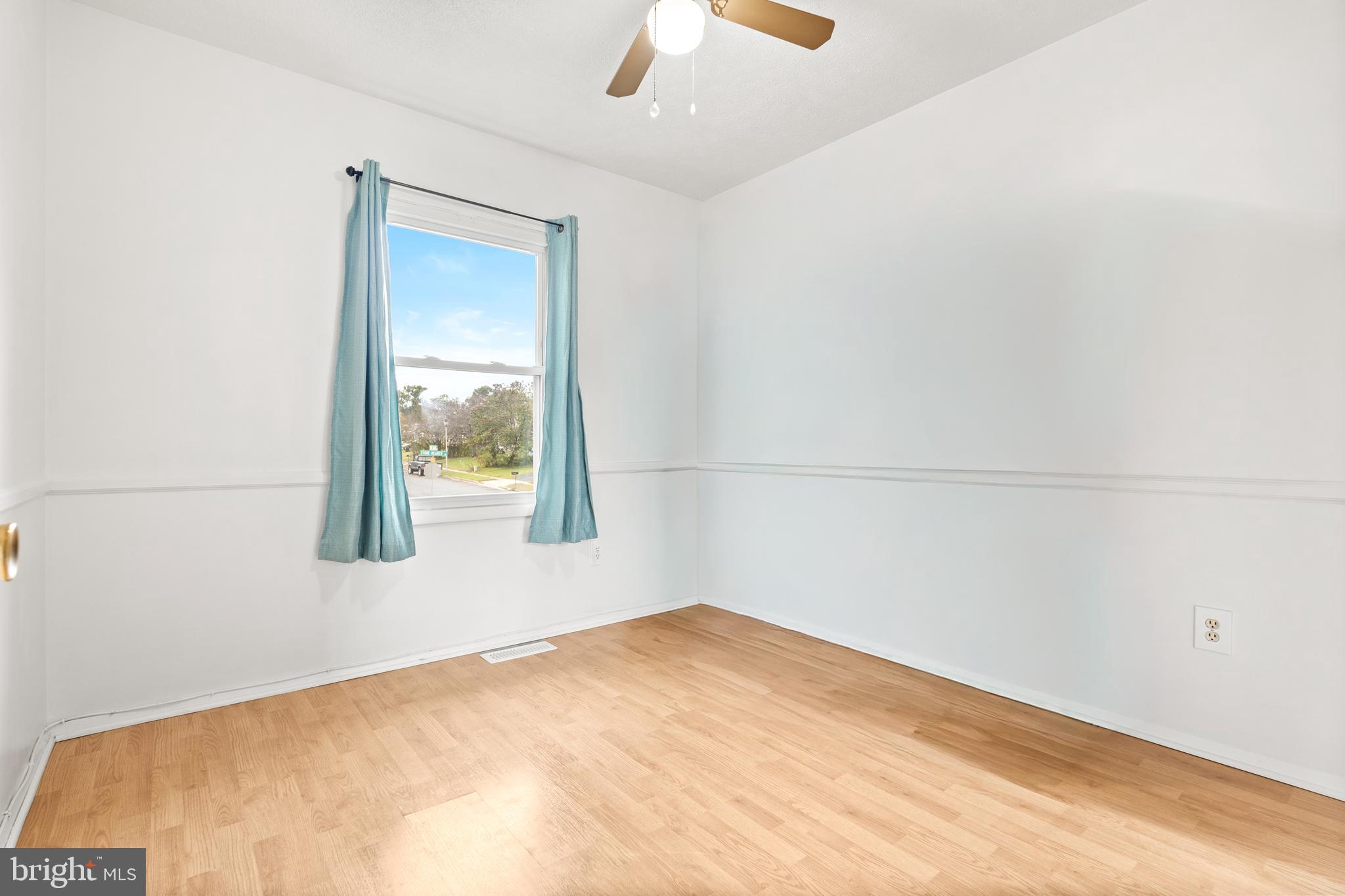 7907 Stone Hearth Road Severn, MD 21144 - Photo 18 of 24 an empty room with a window
