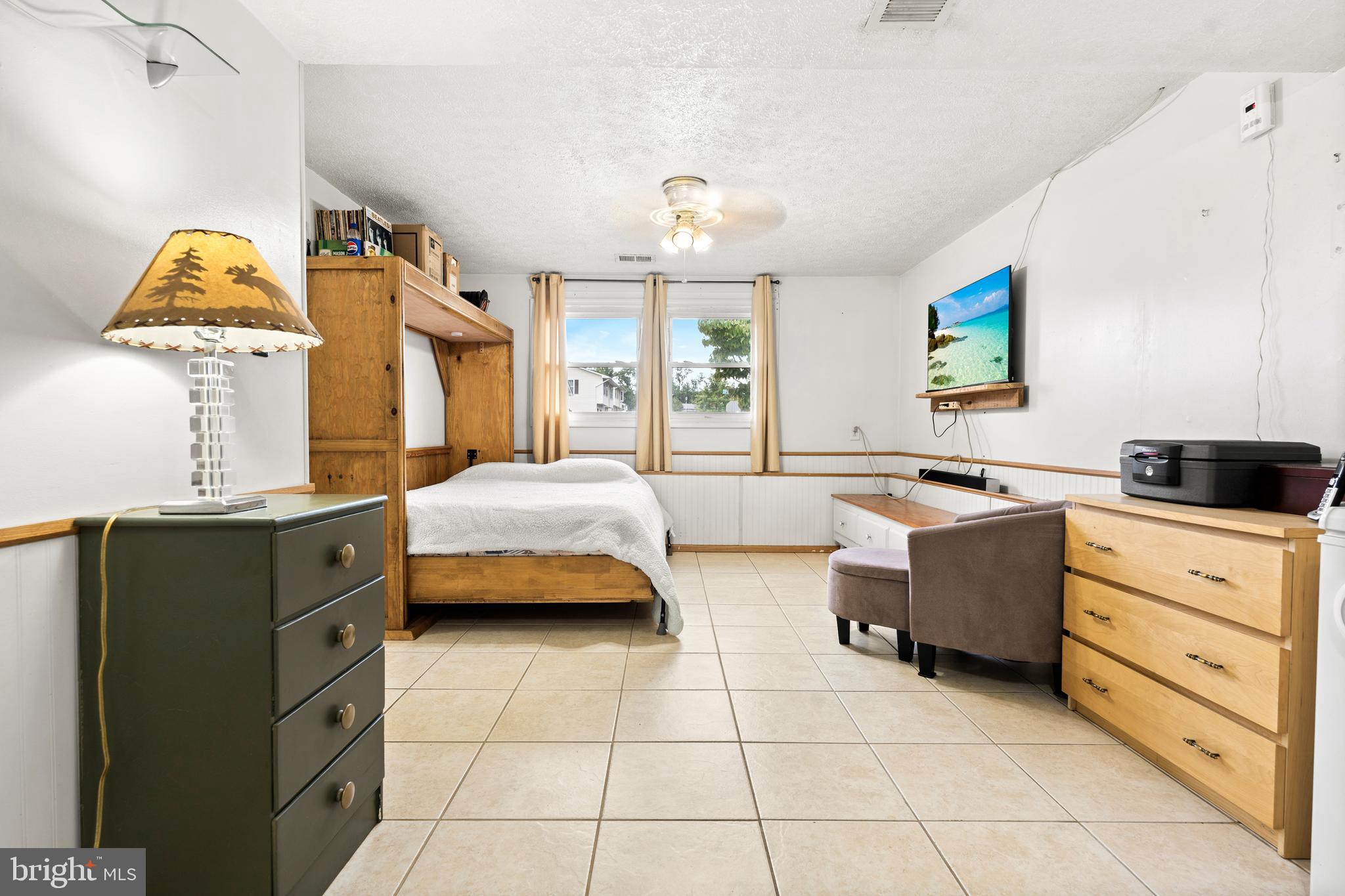 7907 Stone Hearth Road Severn, MD 21144 - Photo 19 of 24 a spacious bathroom with a double vanity sink mirror and tub